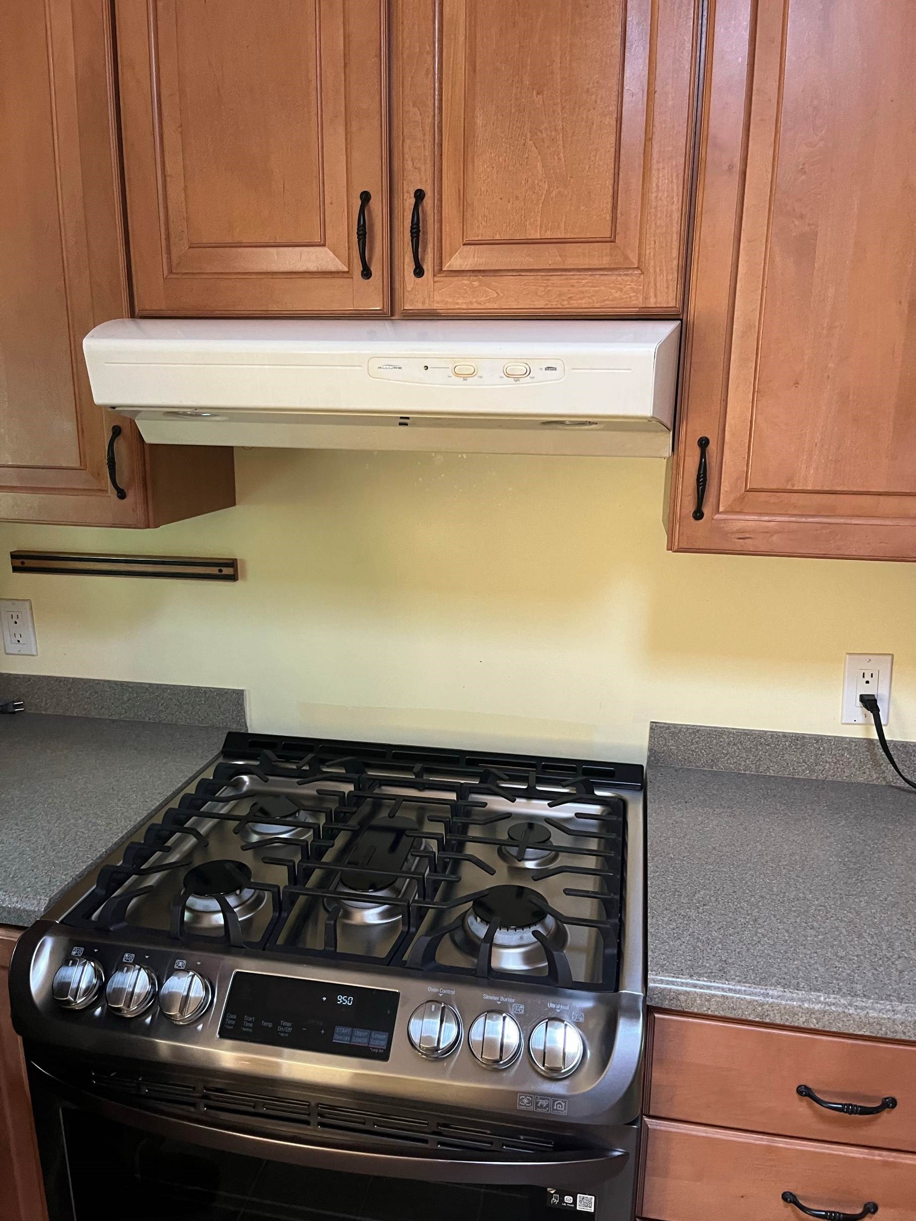 https://acehandyman-dss.ingeniuxondemand.com/Images/Offices/North Carolina/Durham Chapel Hill/ace-handyman-services-durham-chapel-hill-durham-nc-27703-over-range-microwave-install-before.jpg Outdated range hood before replacement kitchen upgrade project by Ace Handyman Services Durham Chapel Hill NC