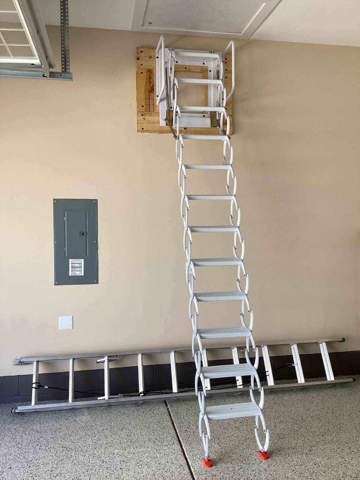 https://acehandyman-dss.ingeniuxondemand.com/Images/Offices/North Carolina/Greater Triangle/Photos/33343130-scissor-attic-ladder-garage-youngsville-27596.jpg Telescoping scissor ladder installation in a Youngsville garage — the install Brenda reviews below