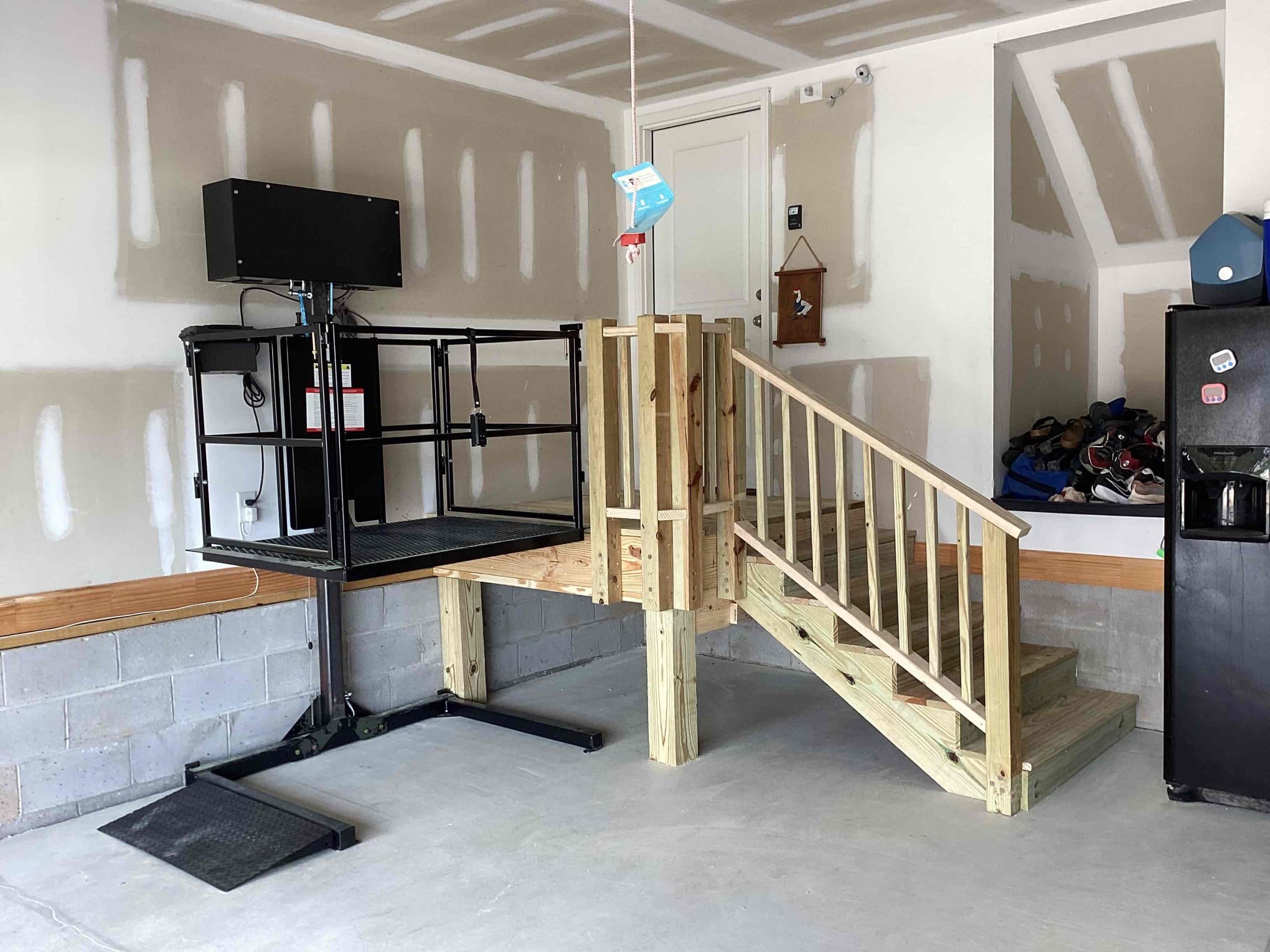 https://acehandyman-dss.ingeniuxondemand.com/Images/Offices/North Carolina/Greater Triangle/Photos/Ace-Handyman-Services-Greater-Triangle-Aging-In-Place-Modification-Complete.jpg A completed interior staircase/platform modification and a wheel chair lift installation by Ace Handyman Services Greater Triangle
