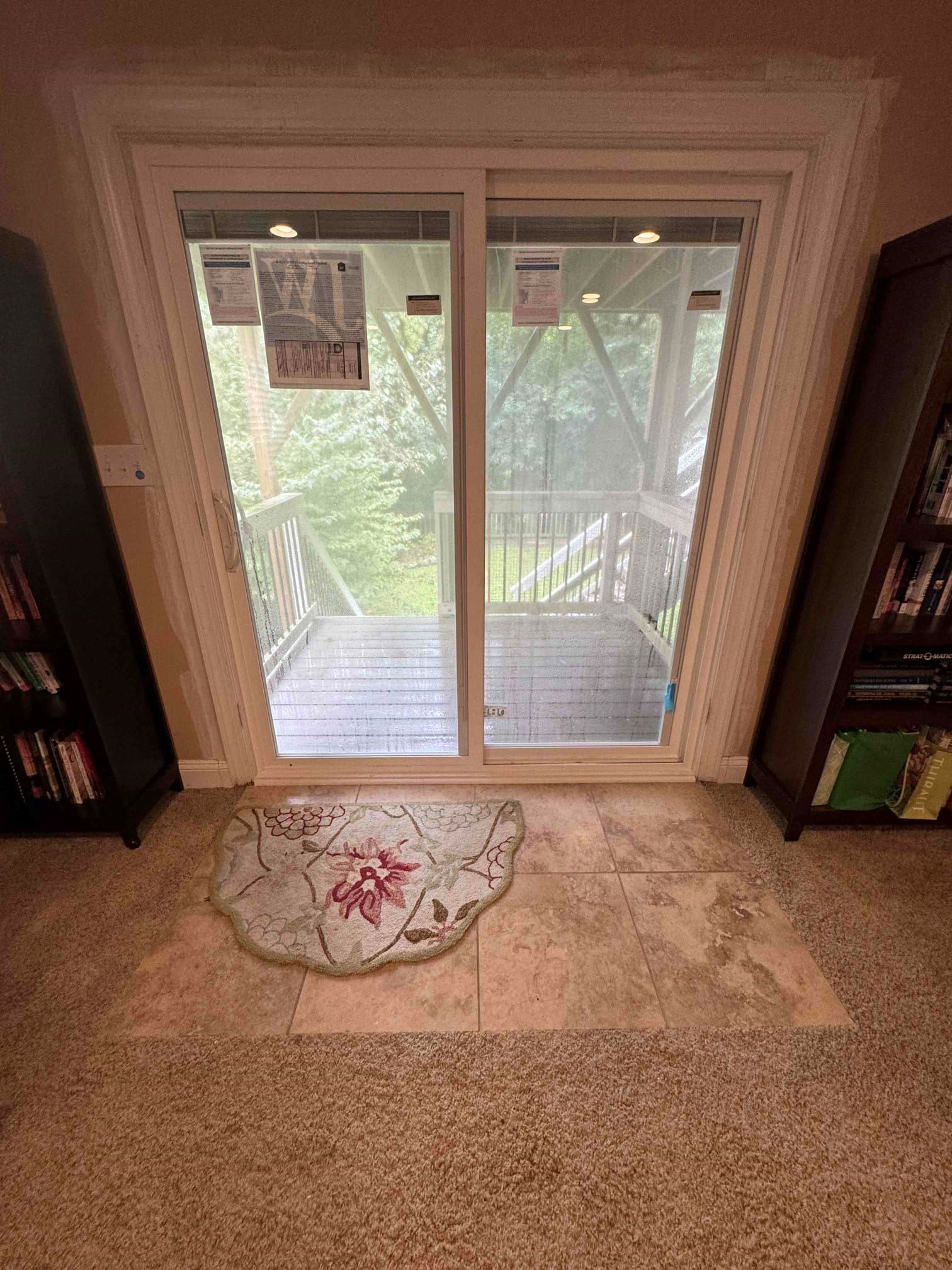 Sliding glass door installation with porch view.